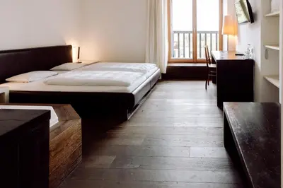 Ein Bett oder Betten in einem Zimmer der Unterkunft Hirzinger - Gasthaus und Hotel