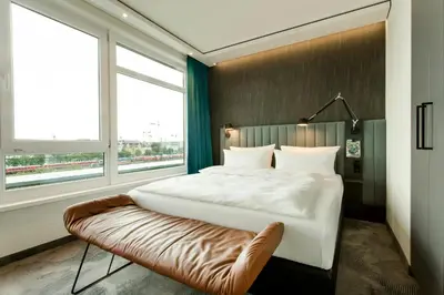 Ein Bett oder Betten in einem Zimmer der Unterkunft Motel One München-East Side