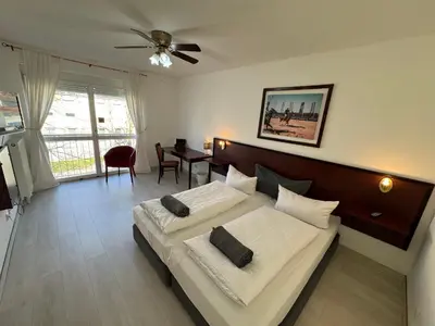 Ein Bett oder Betten in einem Zimmer der Unterkunft Runas Air Muc Park Sleep & Fly