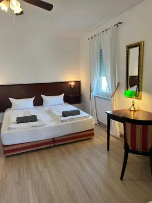 Ein Bett oder Betten in einem Zimmer der Unterkunft Runas Air Muc Park Sleep & Fly