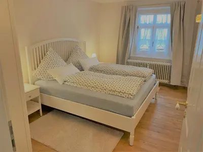 Ein Bett oder Betten in einem Zimmer der Unterkunft Ferienwohnung Giacomelli 4
