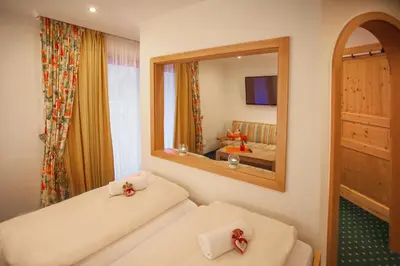 Ein Bett oder Betten in einem Zimmer der Unterkunft ARNIKA Garni
