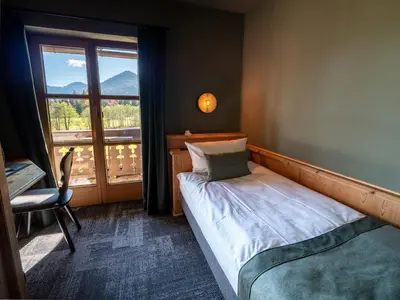 Ein Bett oder Betten in einem Zimmer der Unterkunft Berghotel Sonnenbichl