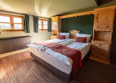 Ein Bett oder Betten in einem Zimmer der Unterkunft Berghotel Sonnenbichl