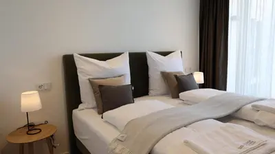 Ein Bett oder Betten in einem Zimmer der Unterkunft MUNICH FINEST APARTMENTS