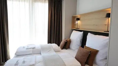 Ein Bett oder Betten in einem Zimmer der Unterkunft MUNICH FINEST APARTMENTS