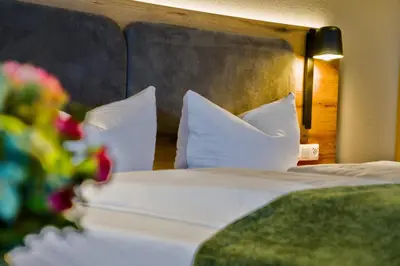 Ein Bett oder Betten in einem Zimmer der Unterkunft Hotel Happinger Hof