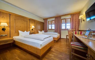 Ein Bett oder Betten in einem Zimmer der Unterkunft Hotel Happinger Hof