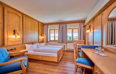 Ein Bett oder Betten in einem Zimmer der Unterkunft Hotel Happinger Hof
