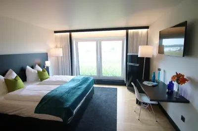 Ein Bett oder Betten in einem Zimmer der Unterkunft AM Hotel by WMM Hotels