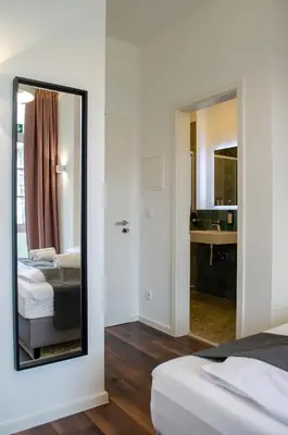 Ein Bett oder Betten in einem Zimmer der Unterkunft HOMELY STAY Studio 8 - Relaxed Self-Check-In room in Munich