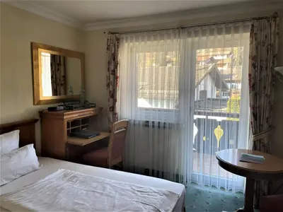Ein Bett oder Betten in einem Zimmer der Unterkunft Ammergauer Zeitgeist