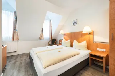 Ein Bett oder Betten in einem Zimmer der Unterkunft Am Klostergarten