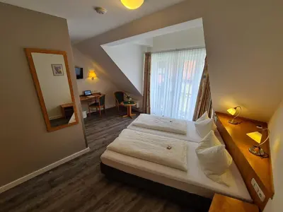 Ein Bett oder Betten in einem Zimmer der Unterkunft Am Klostergarten