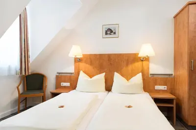 Ein Bett oder Betten in einem Zimmer der Unterkunft Am Klostergarten