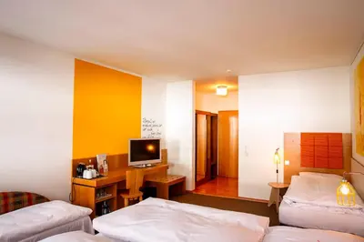 Ein Bett oder Betten in einem Zimmer der Unterkunft Hotel Gut Schwaige