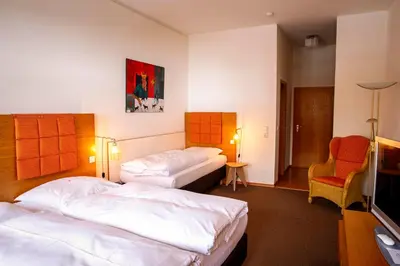 Ein Bett oder Betten in einem Zimmer der Unterkunft Hotel Gut Schwaige