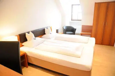 Ein Bett oder Betten in einem Zimmer der Unterkunft Boardinghouse Wadenspanner