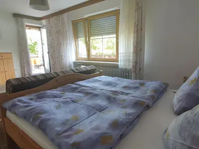 Ein Bett oder Betten in einem Zimmer der Unterkunft Ferienwohnung Weißenbacher