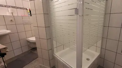 Ein Badezimmer in der Unterkunft Ferienwohnungen Heinrichsberger