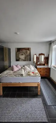 Ein Bett oder Betten in einem Zimmer der Unterkunft Ferienwohnungen Heinrichsberger