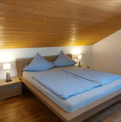Ein Bett oder Betten in einem Zimmer der Unterkunft Ferienwohnung Holzmaier