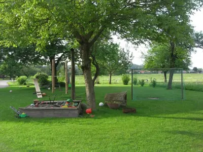 Ein Garten an der Unterkunft Baumgartner Nagerhof | Chiemgau Karte