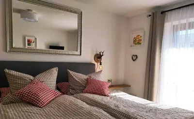 Ein Bett oder Betten in einem Zimmer der Unterkunft Ferienwohnung Rabe