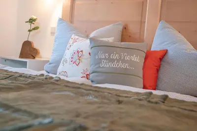 Ein Bett oder Betten in einem Zimmer der Unterkunft Ferienwohnungen Beim Plößl
