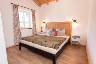 Ein Bett oder Betten in einem Zimmer der Unterkunft Ferienwohnungen Beim Plößl