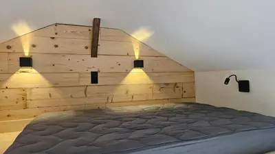 Ein Bett oder Betten in einem Zimmer der Unterkunft Ferienhaus Achental mit Sauna