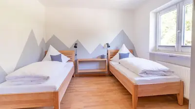 Ein Bett oder Betten in einem Zimmer der Unterkunft Ferienhaus Achental mit Sauna