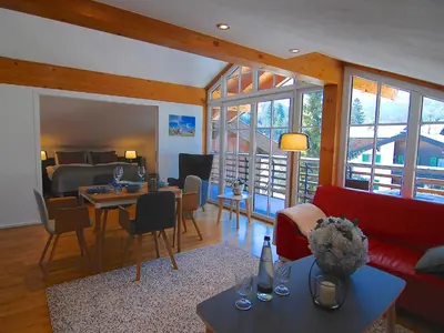 Ein Sitzbereich in der Unterkunft Hubertus Apartments