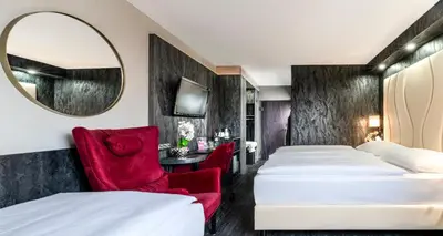 Ein Bett oder Betten in einem Zimmer der Unterkunft PLAZA INN Mühldorf