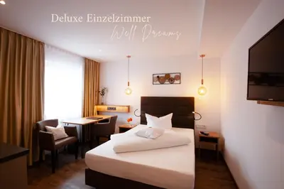 Ein Bett oder Betten in einem Zimmer der Unterkunft Hotel Schwaiger