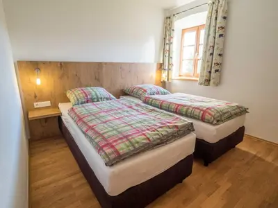 Ein Bett oder Betten in einem Zimmer der Unterkunft Heimhilgerhof