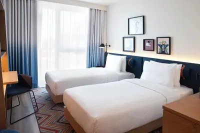 Ein Bett oder Betten in einem Zimmer der Unterkunft Hampton by Hilton Munich Airport South