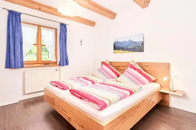 Ein Bett oder Betten in einem Zimmer der Unterkunft Ferienwohnung Wallner