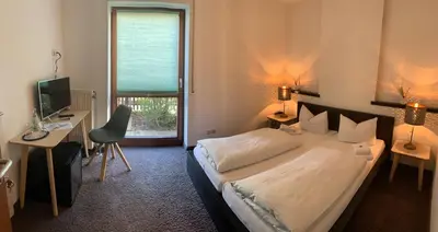 Ein Bett oder Betten in einem Zimmer der Unterkunft Hotel Augsburg Langemarck