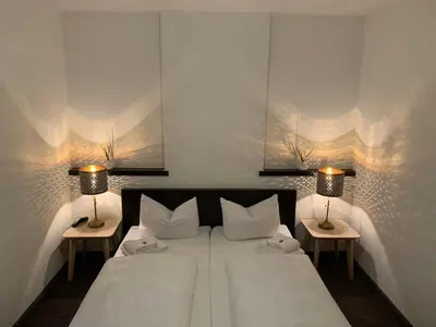 Ein Bett oder Betten in einem Zimmer der Unterkunft Hotel Augsburg Langemarck
