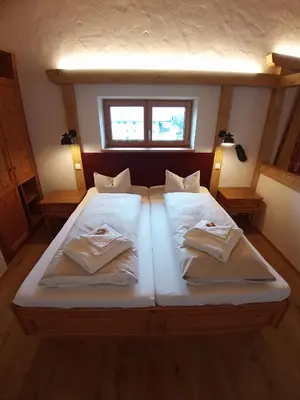 Ein Bett oder Betten in einem Zimmer der Unterkunft Gasthof Ochsenwirt