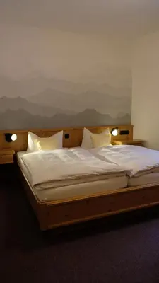 Ein Bett oder Betten in einem Zimmer der Unterkunft Seehotel Grauer Bär