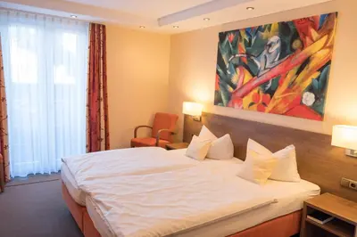 Ein Bett oder Betten in einem Zimmer der Unterkunft Seehotel Grauer Bär