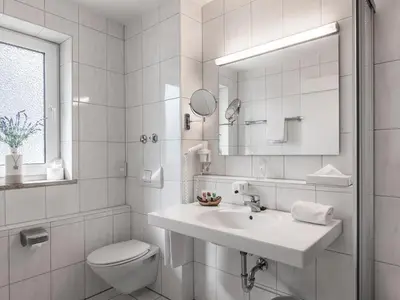 Ein Badezimmer in der Unterkunft Hotel Am Moosfeld