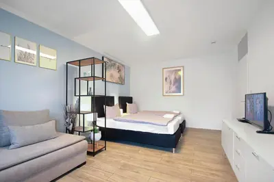 Ein Bett oder Betten in einem Zimmer der Unterkunft Eddy's Rest & Relax - Munich East
