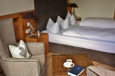 Ein Bett oder Betten in einem Zimmer der Unterkunft Parkhotel am Soier See