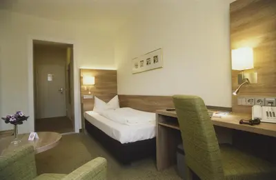 Ein Bett oder Betten in einem Zimmer der Unterkunft Hotel Jedermann