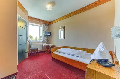 Ein Bett oder Betten in einem Zimmer der Unterkunft Kneipp-Kurhotel Emilie