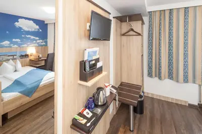 Ein Bett oder Betten in einem Zimmer der Unterkunft Hotel Blauer Karpfen