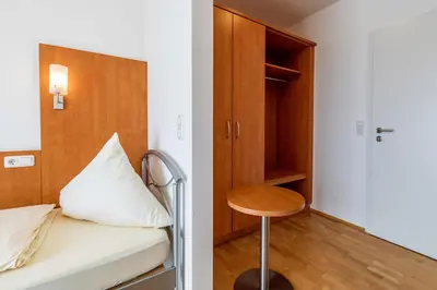 Ein Bett oder Betten in einem Zimmer der Unterkunft Gasthaus Hotel Ostermeier